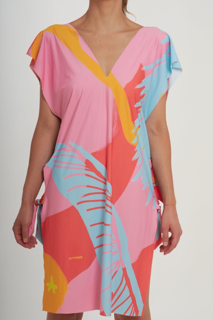 Poncho playero tropical · Cómodo y versátil
